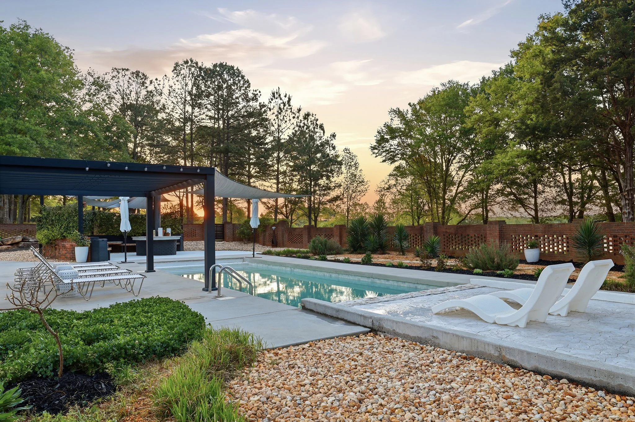 The pool area features rock gardens, clover meadows, and a variety of tropical and native plants for variation