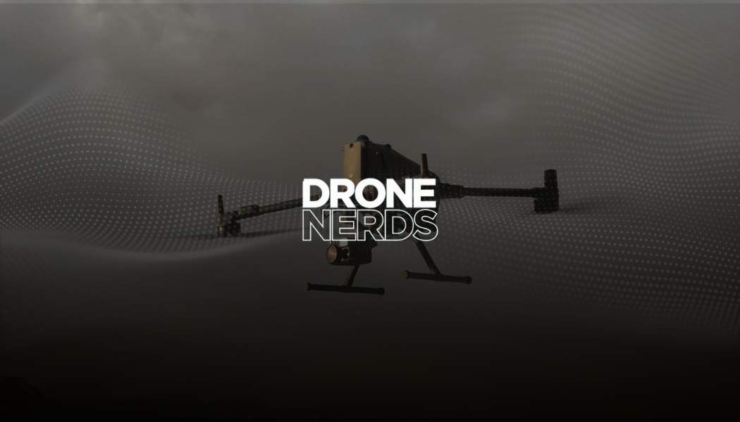 A drone flying in the air with the text 'DRONE NERDS' overlaid in the center of the image.