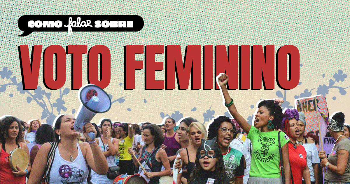 Grupo de mulheres participando de uma manifestação por direitos femininos, algumas usando camisetas com frases, uma mulher usando máscara, e uma pessoa gritando usando um megafone, com cartazes e bandeiras ao fundo.