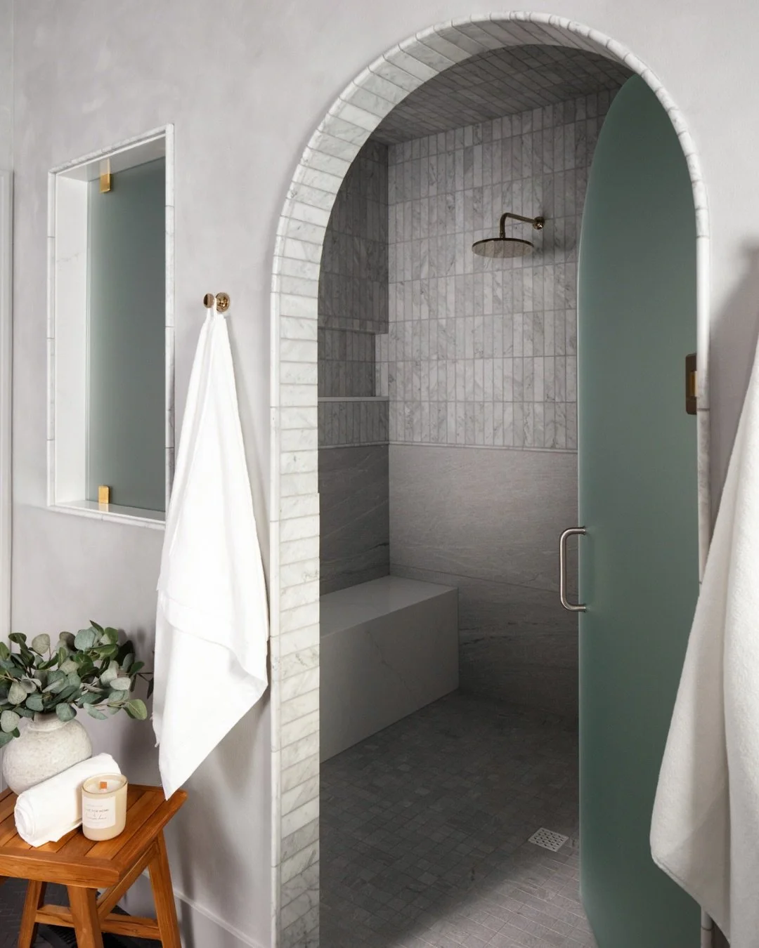 This bathroom carries through the arches seen throughout the rest of the home, creating a sense of continuity and softness within the design.

One of the most meaningful parts of this space, though, is what&rsquo;s built beneath the surface. 

The sh