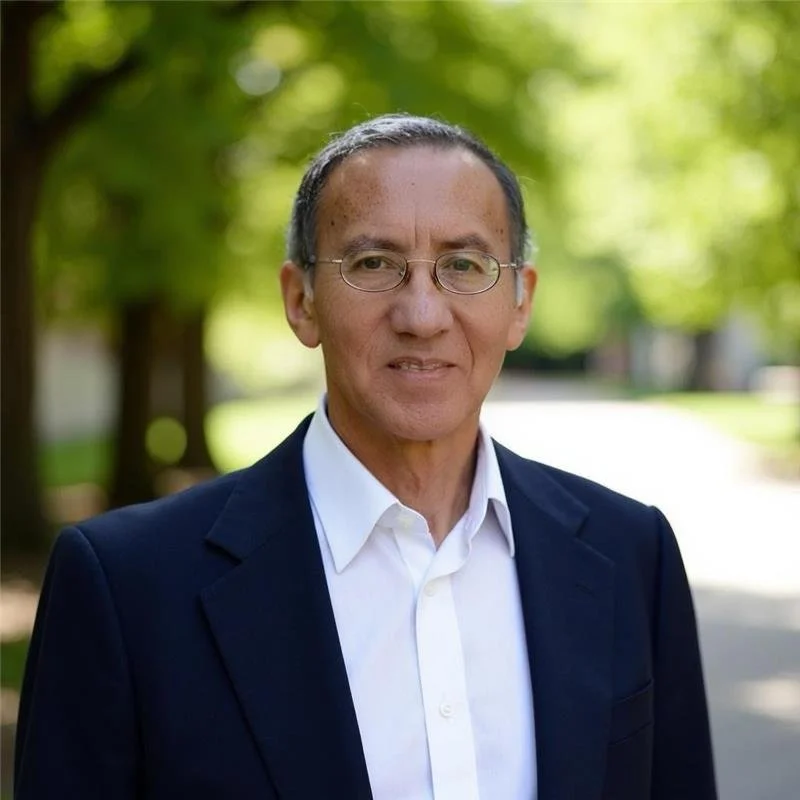 Portrait of a man , smiling, looking directly at the camera.
