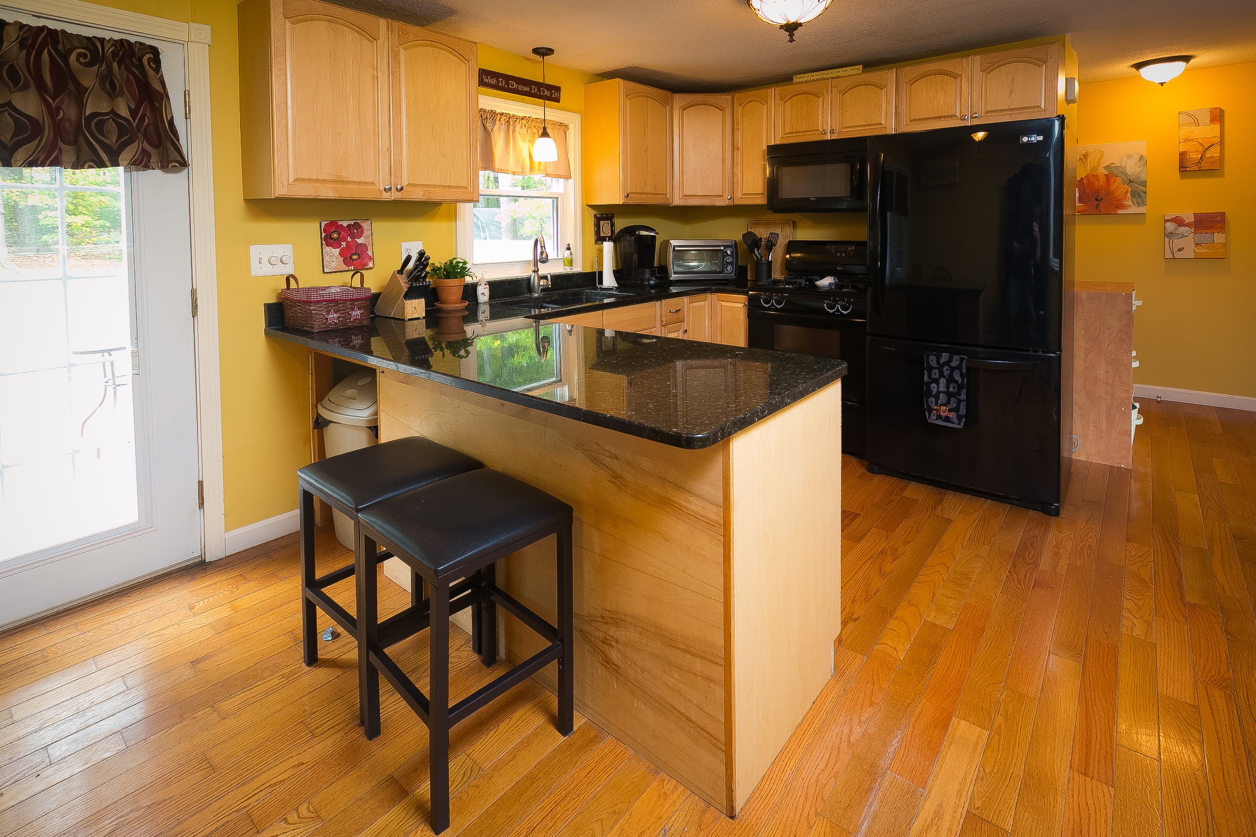 Kitchen with black counter tops