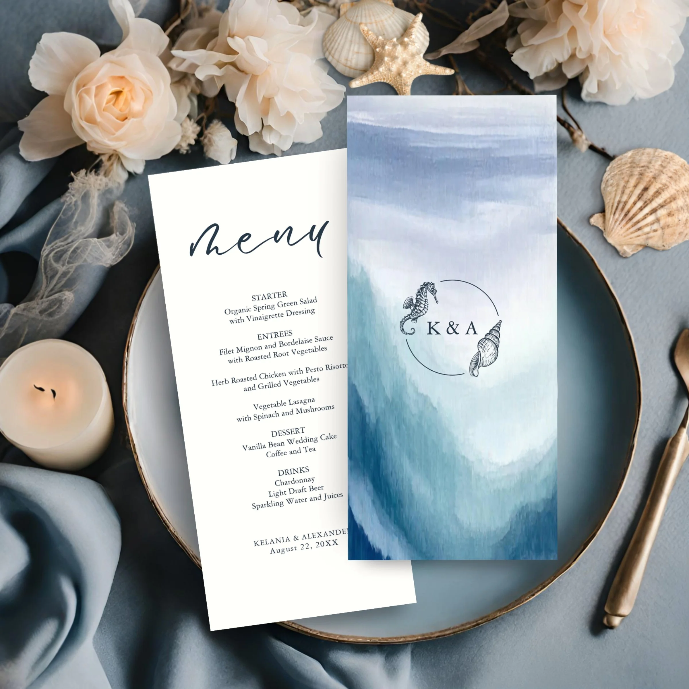 Coastal theme wedding menu featuring food and drink options on the front in navy blue text on a crisp white background. The reverse side features abstract watercolor ocean waves in beach-y blues along with a nautical seahorse and sea shell monogram.