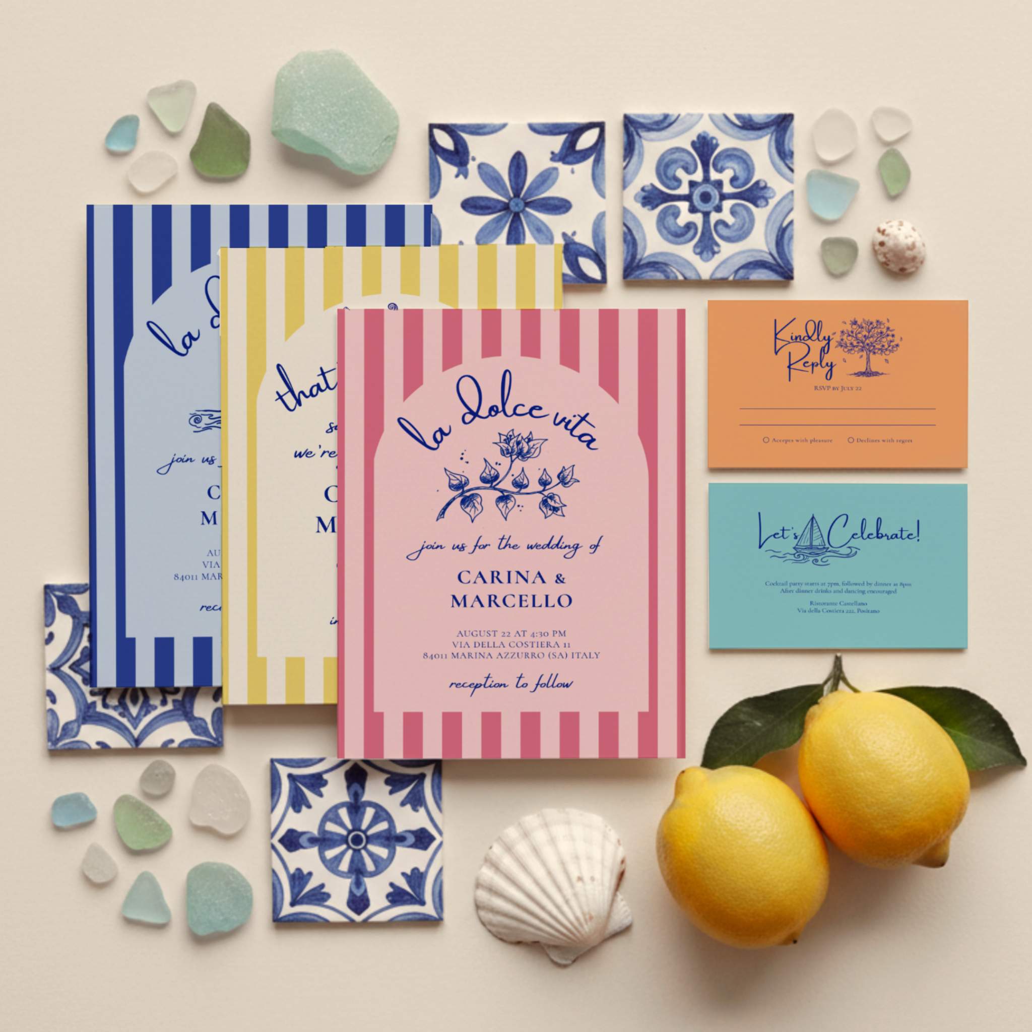 Amalfi Coast Amore wedding invitation suite arranged to show the Mediterranean striped arch designs with coordinating solid-color enclosure and response cards, featuring hand-drawn lemon branches, bougainvillea, and orange tree doodles.
