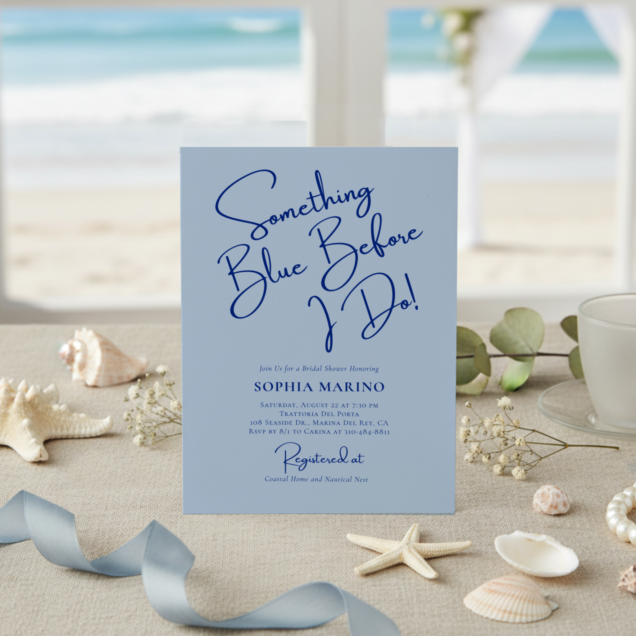 “Something Blue Before I Do” bridal shower invitation inspired by the charm of the Amalfi Coast. A soft dusty-blue background pairs beautifully with deep cobalt lettering and handwriting-style script, while the reverse features the signature Mediterr