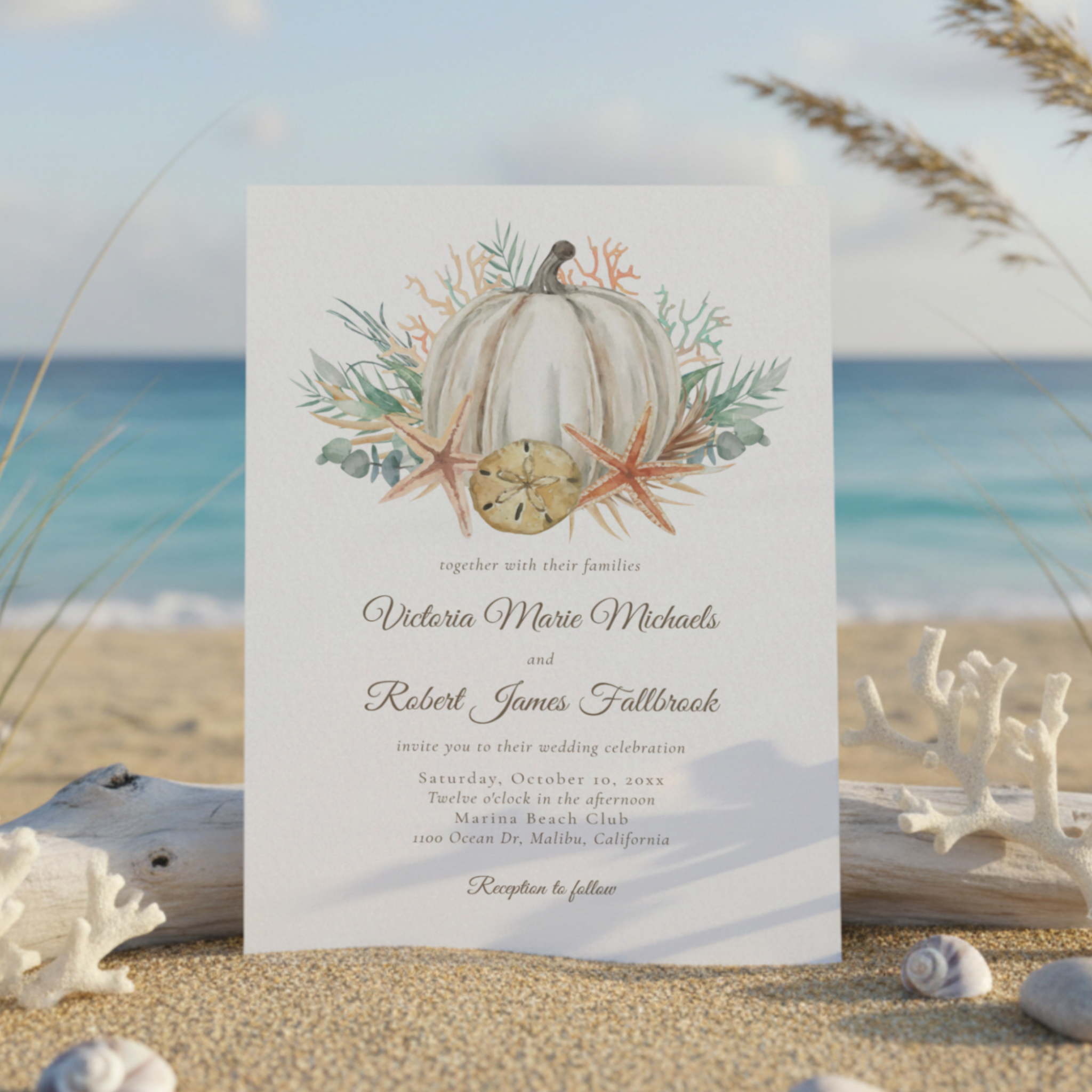 Coastal fall wedding invitation featuring a watercolor pumpkin, seashells, starfish, coral, palm and eucalyptus greenery. Perfect for autumn beach weddings