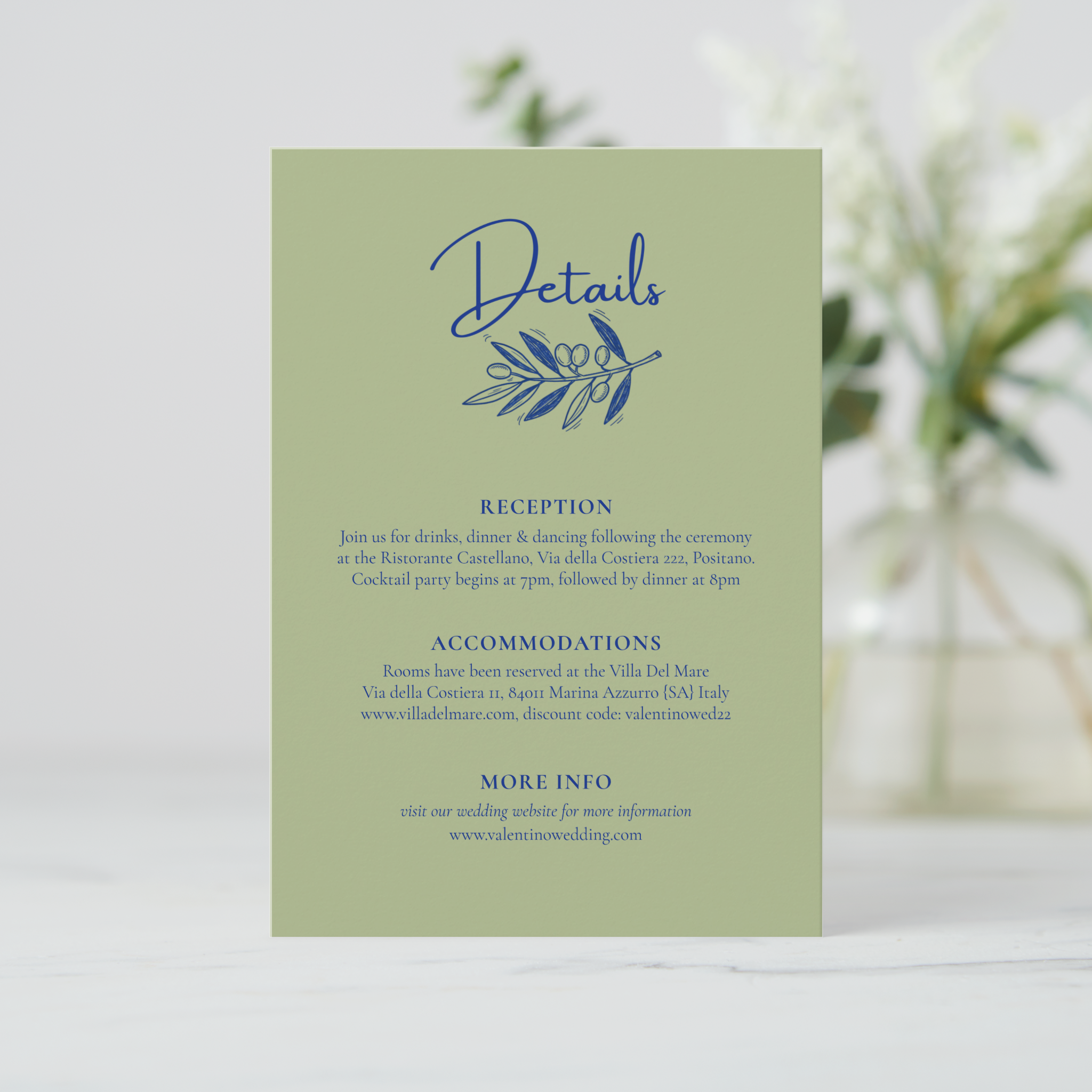Wedding details card in solid olive green, featuring a hand-drawn olive branch doodle at the top.
