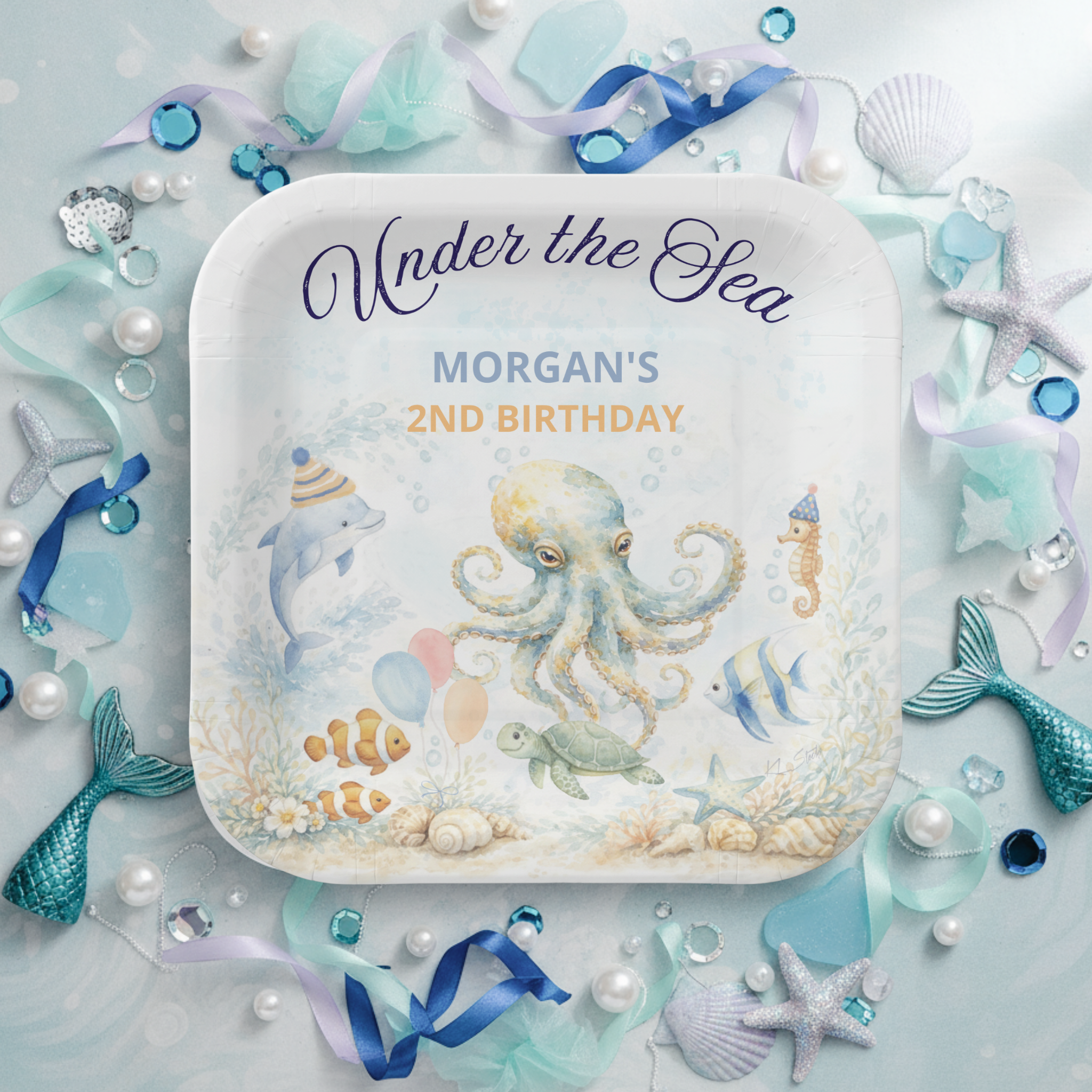 Under the Sea Octopus birthday paper plates featuring a whimsical watercolor scene with an adorable octopus, dolphin, seahorse, sea turtle, and tropical fish around a coral reef. Fun party-hat details and “Under the Sea” script add charming nautical 