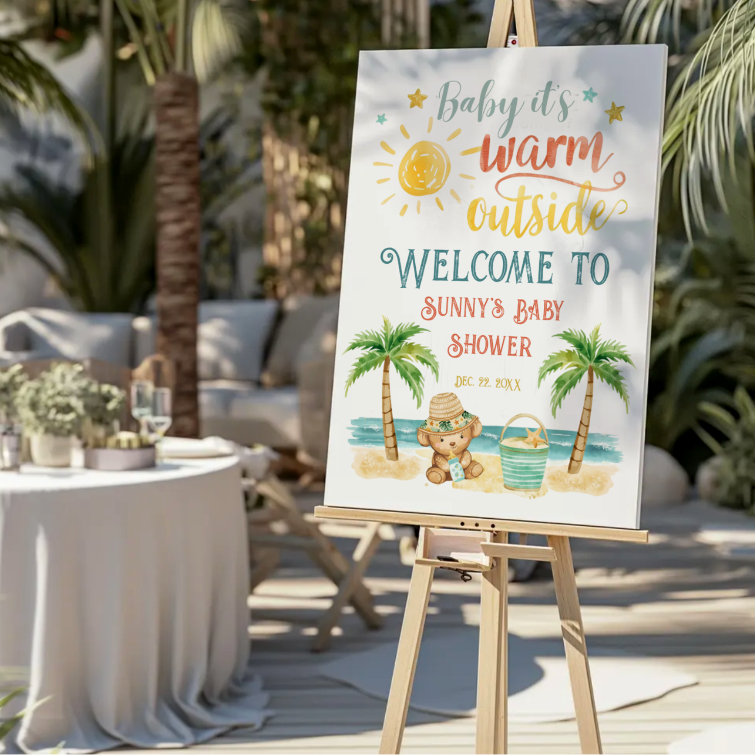 Welcome guests to your baby shower with this “Baby It’s Warm Outside” tropical baby shower foam board sign featuring sunshine, palm trees, ocean waves, sandy beach, starfish, and an adorable stuffed bear