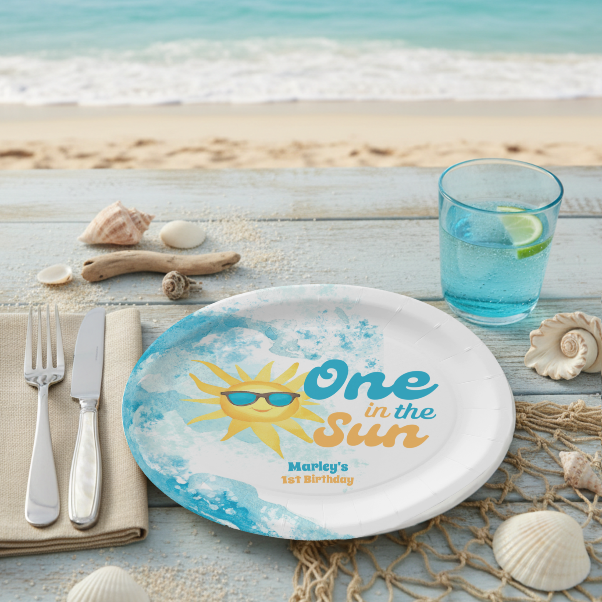 One in the Sun 1st birthday paper plates featuring a watercolor ocean wave, cheerful sun and retro typography in turquoise and coral orange. Perfect for a baby's first beach birthday