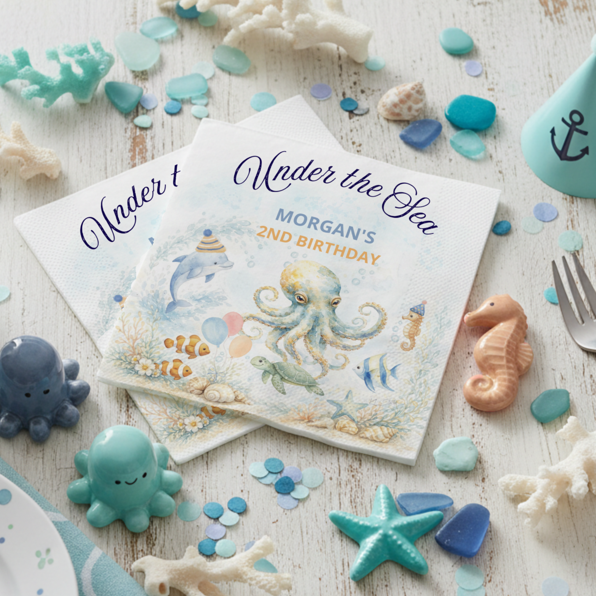 Under the Sea Octopus birthday napkins featuring a whimsical watercolor scene with an adorable octopus, dolphin, seahorse, sea turtle, and tropical fish around a coral reef. Fun party-hat details and “Under the Sea” script add charming nautical flair
