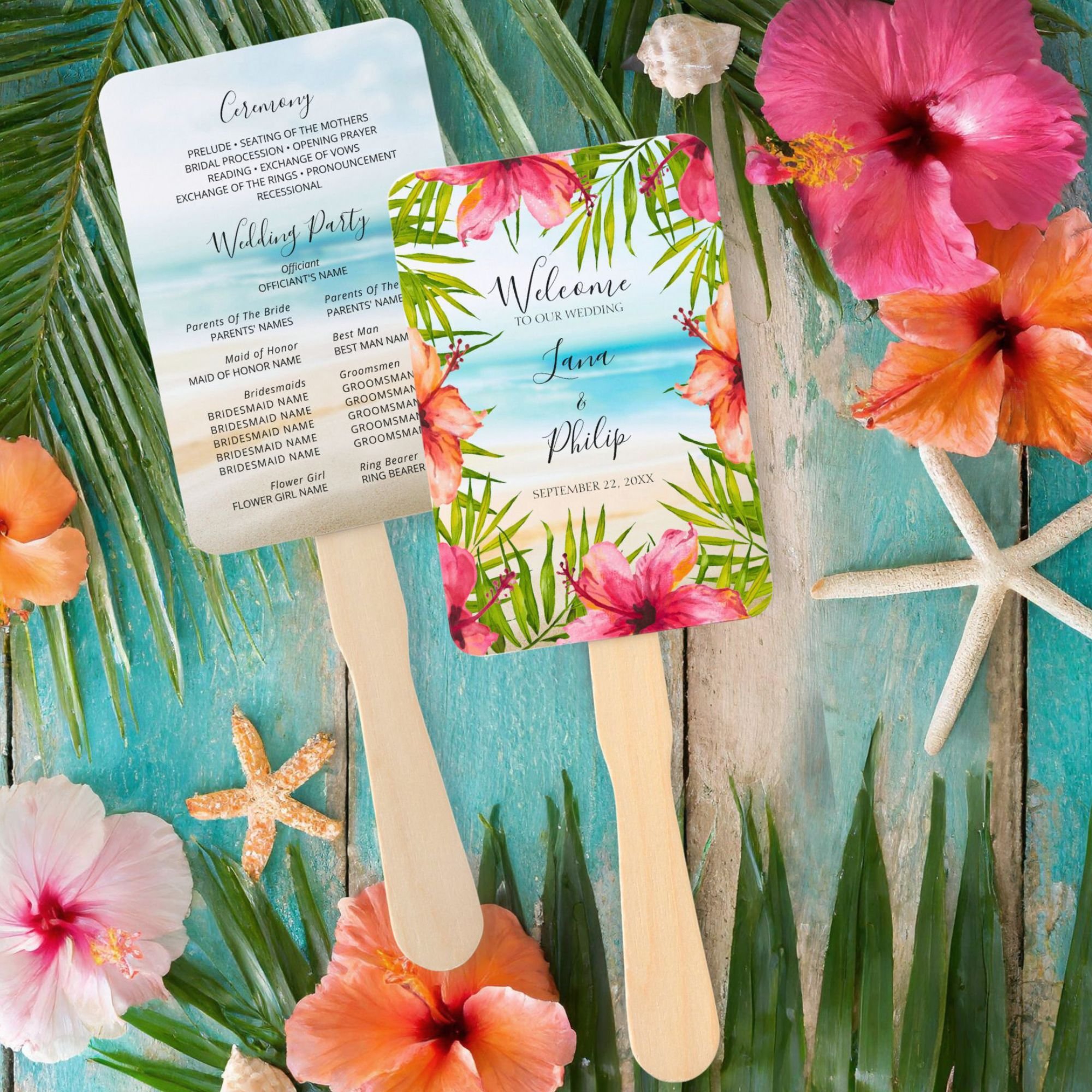 Island theme wedding hand fan featuring a watercolor tropical beach scene with turquoise ocean, sandy shore, palm leaves and hibiscus flowers along with your ceremony and wedding party details