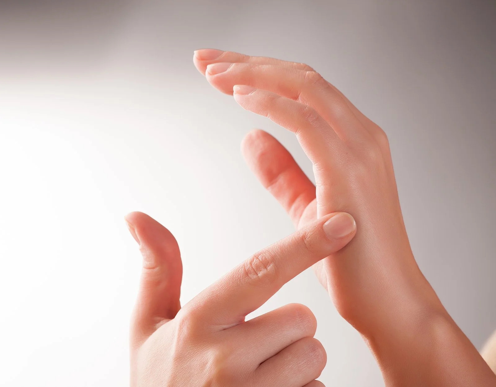 The side of a hand, a common tapping point in EFT, used to calm stress and anxiety.