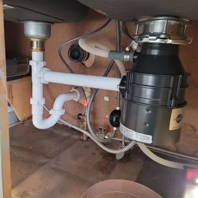 New under-sink garbage disposal replaced by Rx Plumbing in Suwanee, GA.