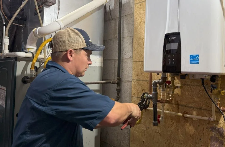 Rx-Plumbing and Drain Master Plumber installing a Navien tankless water heater.