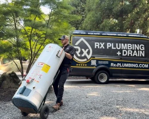 An Rx Plumber removes a traditional water heater from a home in Alpharetta, GA.