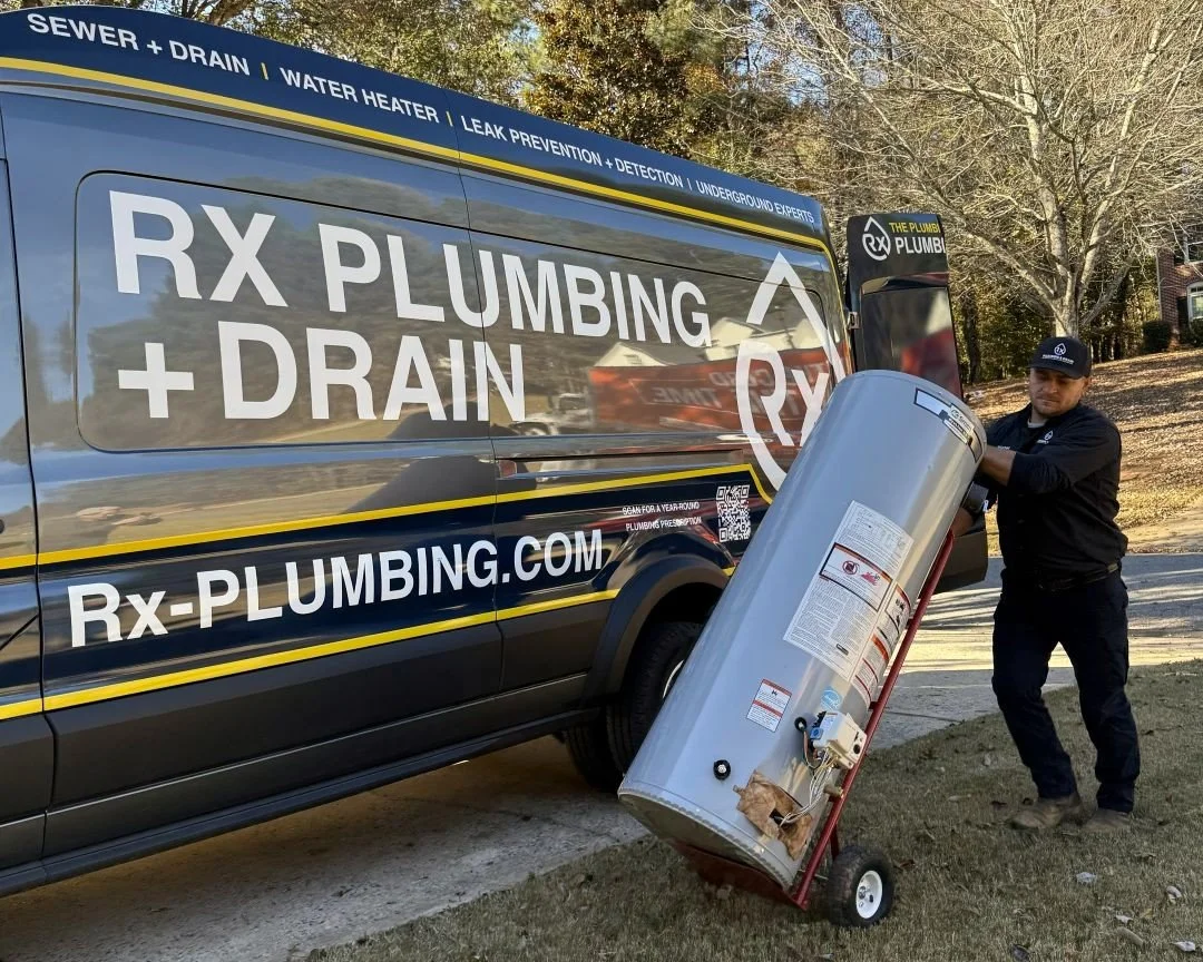 Rx-Plumbing plumber delivering a new traditional tank water heater to a home in Cumming, Georgia.