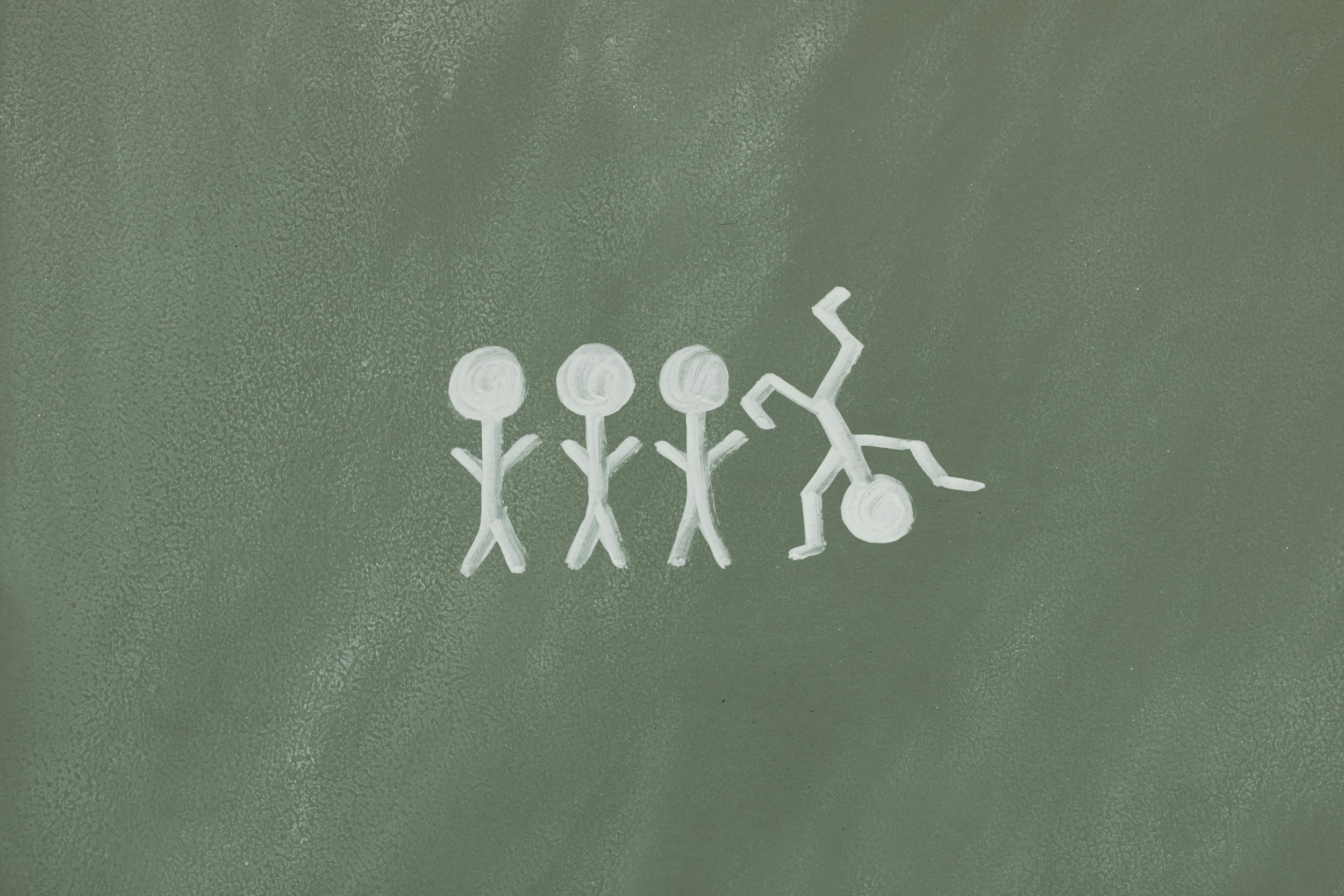 Three stick figure children drawn in chalk wait in line patiently while a fourth does a goofy handstand.