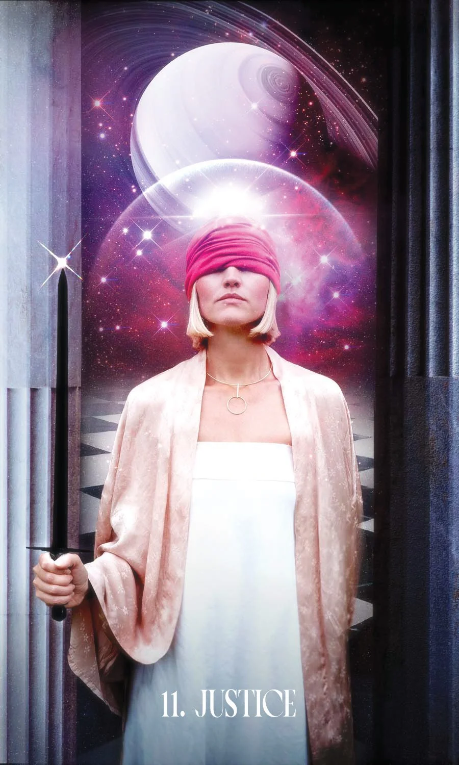 A woman stands with a red blindfold holding a black sword. She stands between 2 pillars, one black and one white. Behind her is the planet Saturn and a black and white checkerboard flood.
