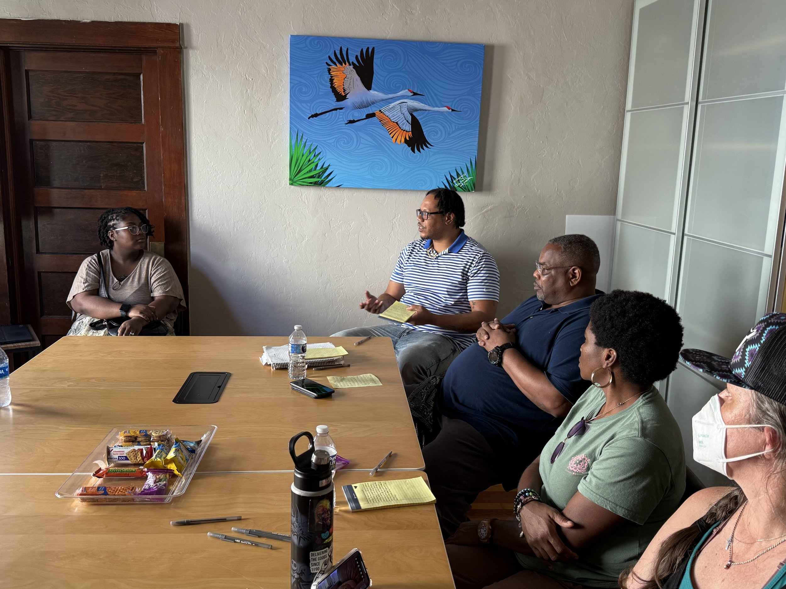 Storytelling Workshop participants speaking with one another.
