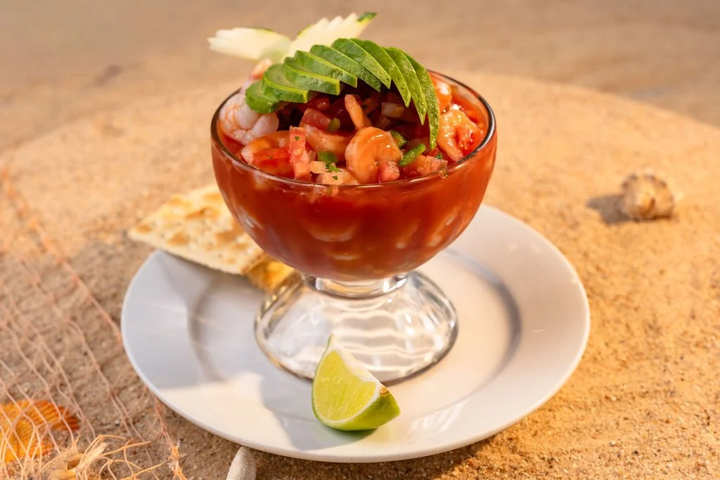 Mexican shrimp cocktail topped with fresh avocado at El Muelle Seafood in Houston