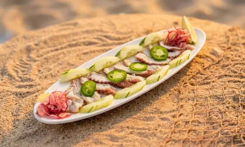 Fresh octopus aguachile with citrus and pico de gallo served at El Muelle Seafood in Houston, TX