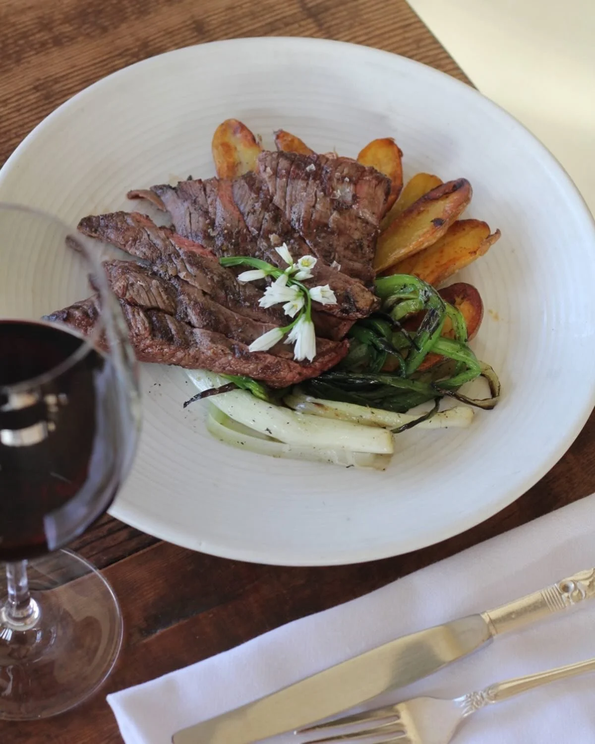 When the world around you feels uneasy, add some whimsy, like a little flower on your steak