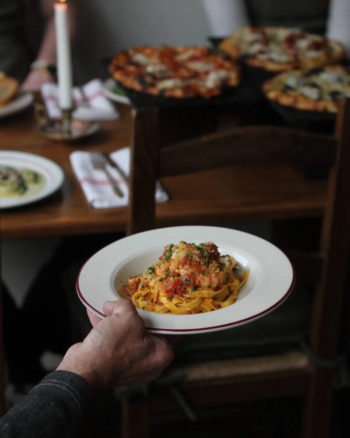 Handmade tagliatelle made with vibrant saffron, served here with seasonal spot prawns and preserved tomatoes. 🍅