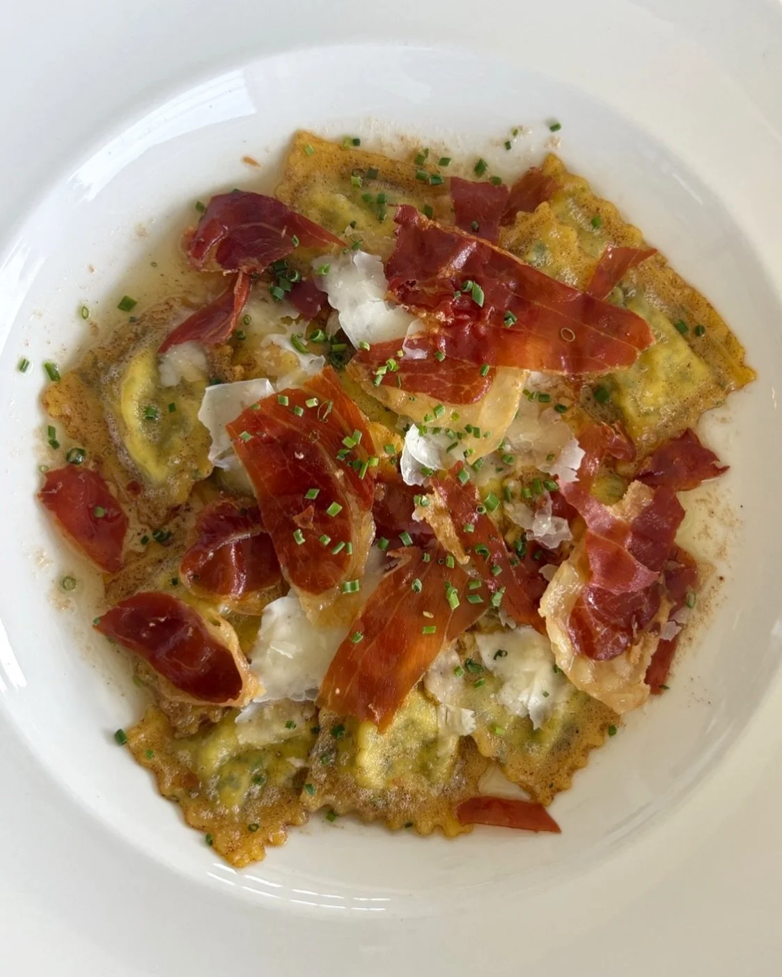 A little brown butter ravioli is never wrong. This spring version is filled with nettles and topped with crispy prosciutto. Come order it before our summer menu launches!