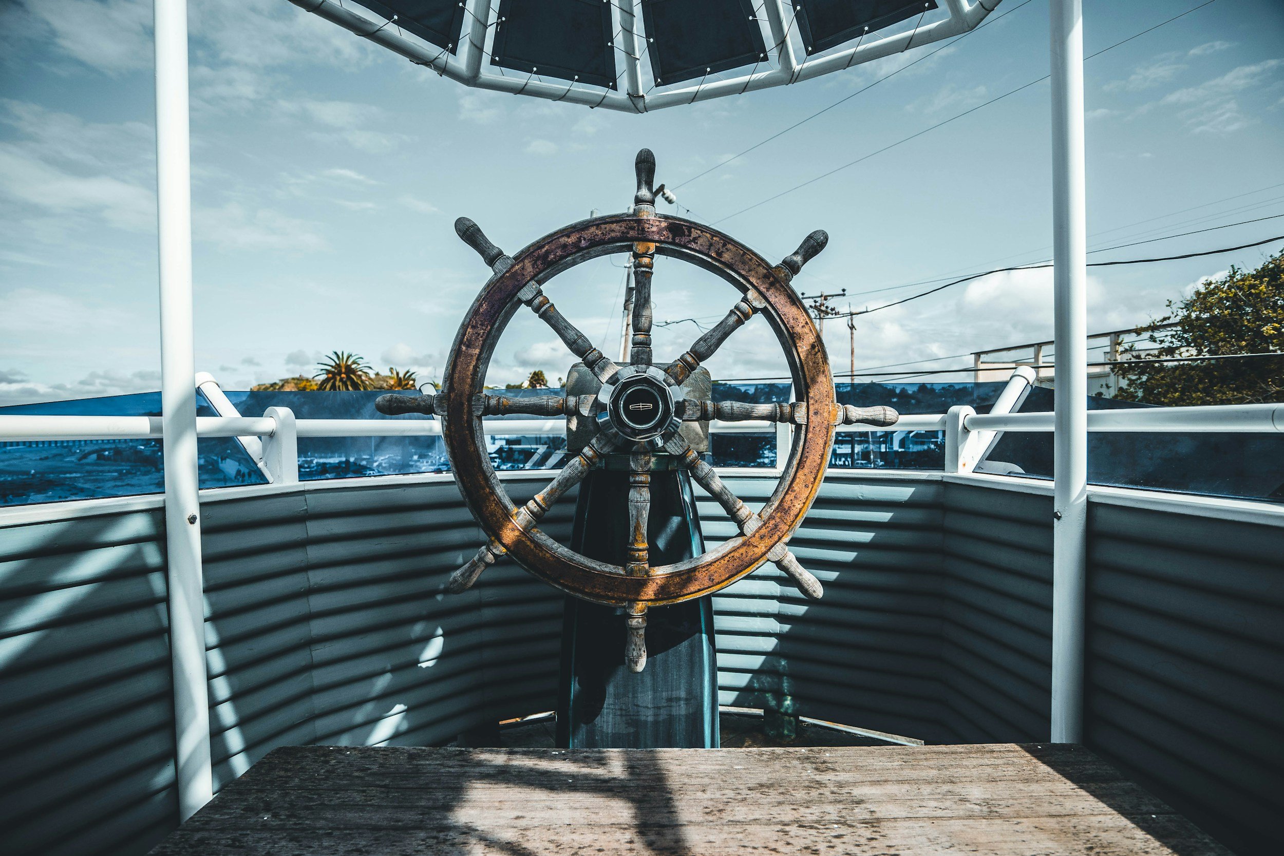 Wooden Captain's Wheel at front of boat