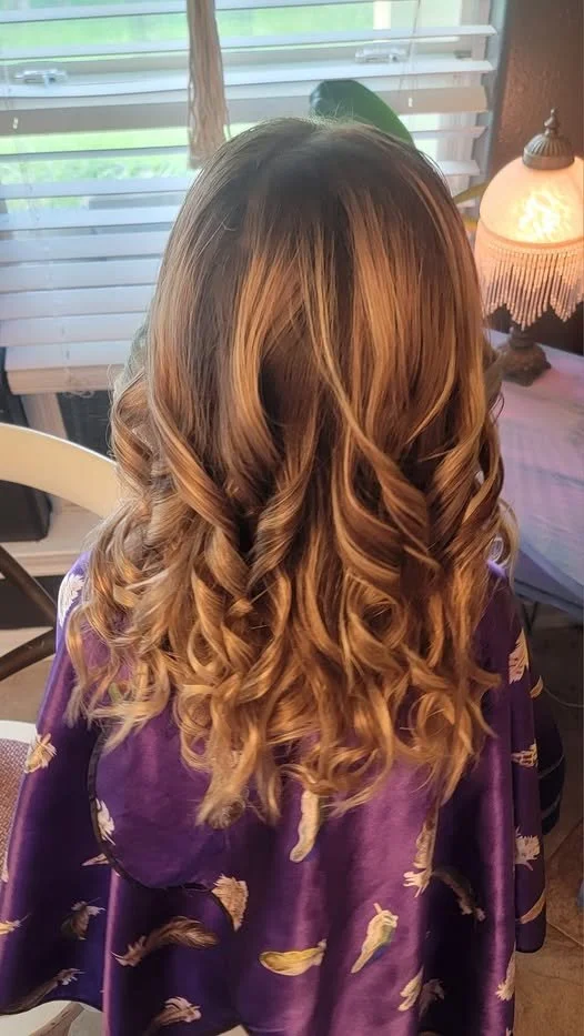 Brunette woman showing back of head after getting hair styled