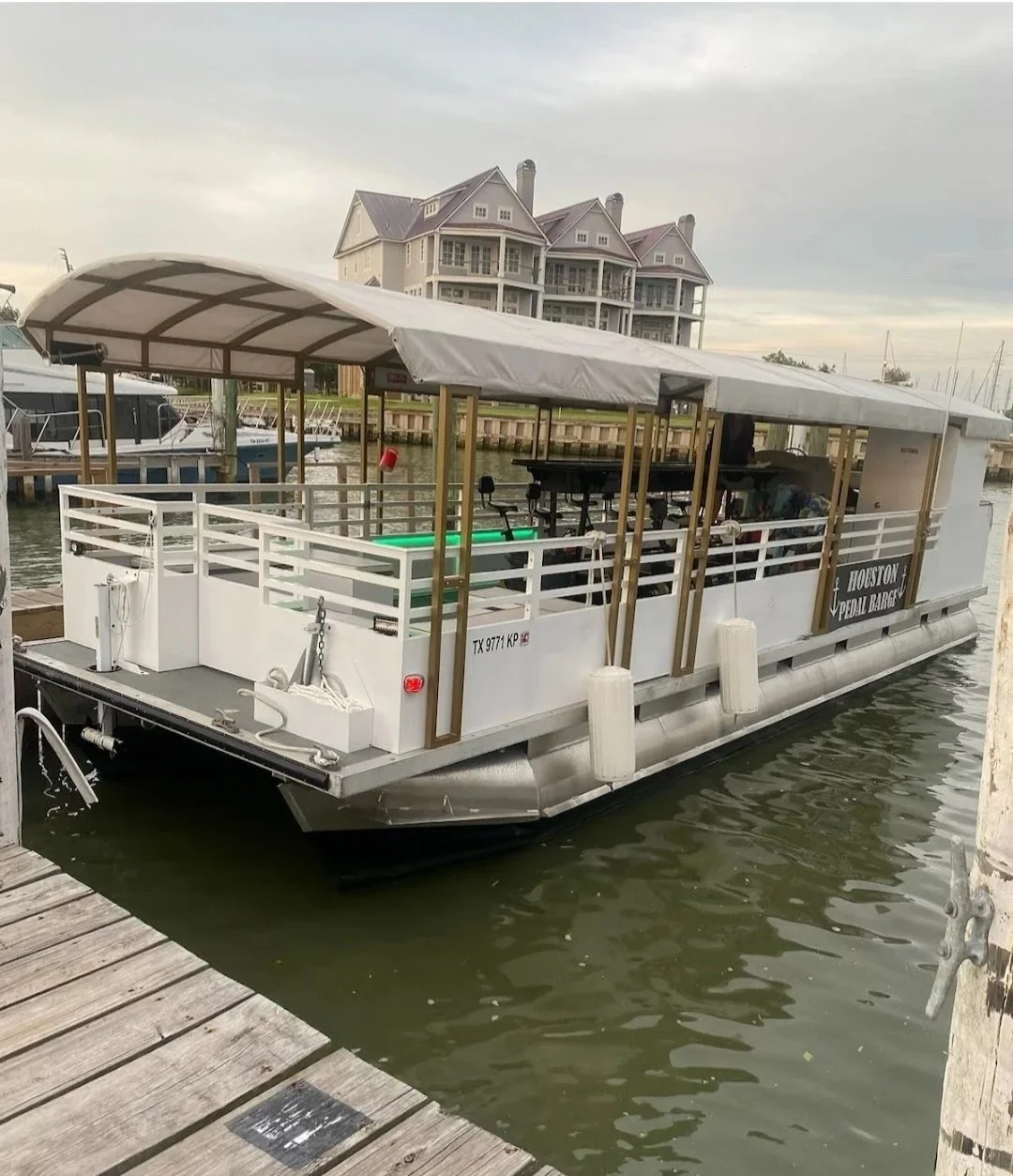 Pedal boat on the water in front of a home