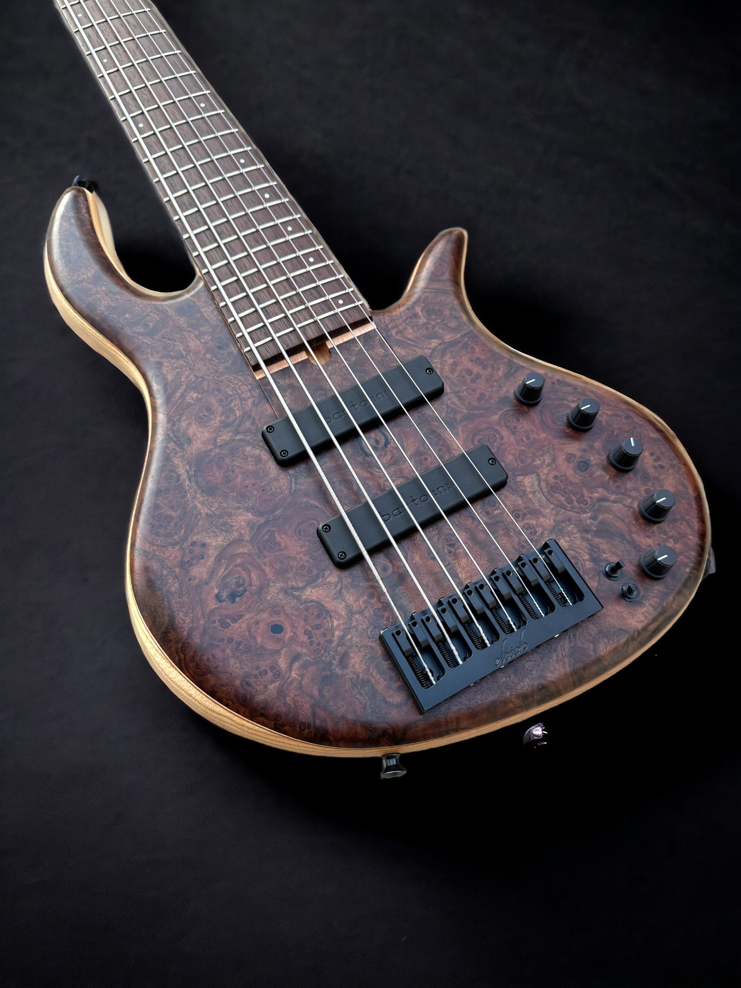 Elrick EVO 6 Walnut Burl FRONT TILTED LEFT-Photoroom.jpg