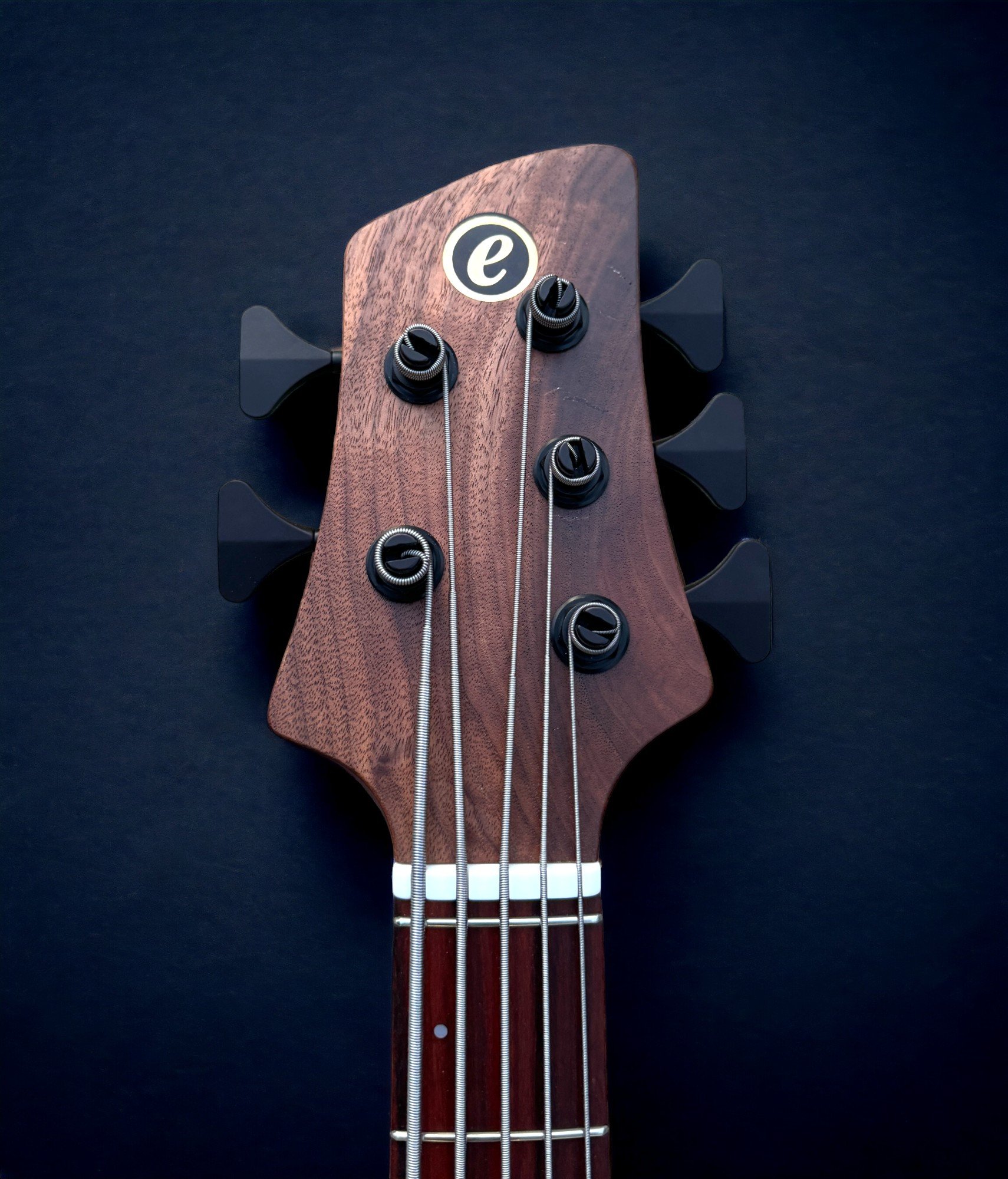 Elrick EVO 5 Figured Walnut HEADSTOCK FRONT-Photoroom.jpg