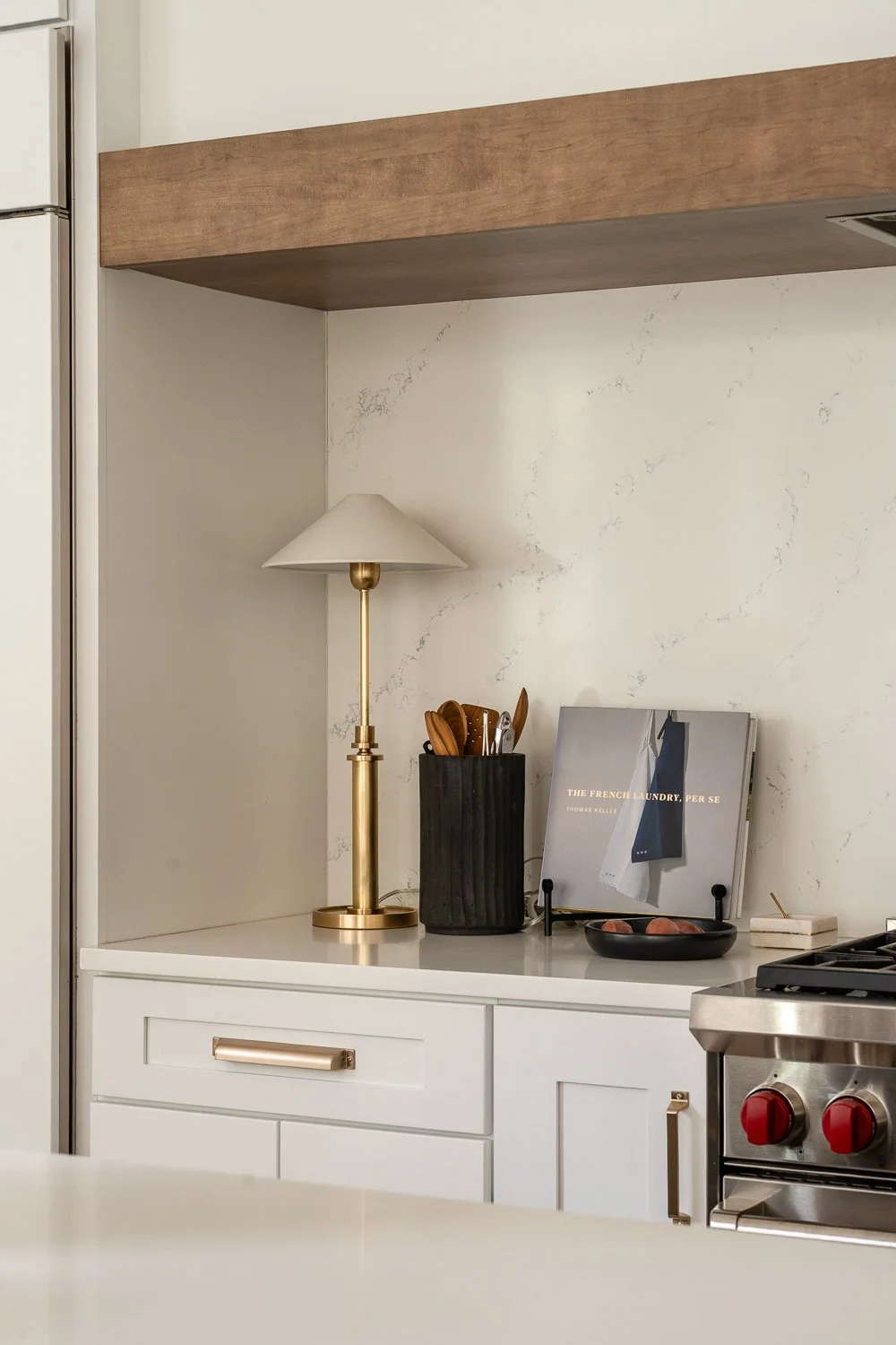 Studio Thomas Denver bespoke interior design no 035 kitchen white marble backsplash counter gold modern lamp cooking accessories