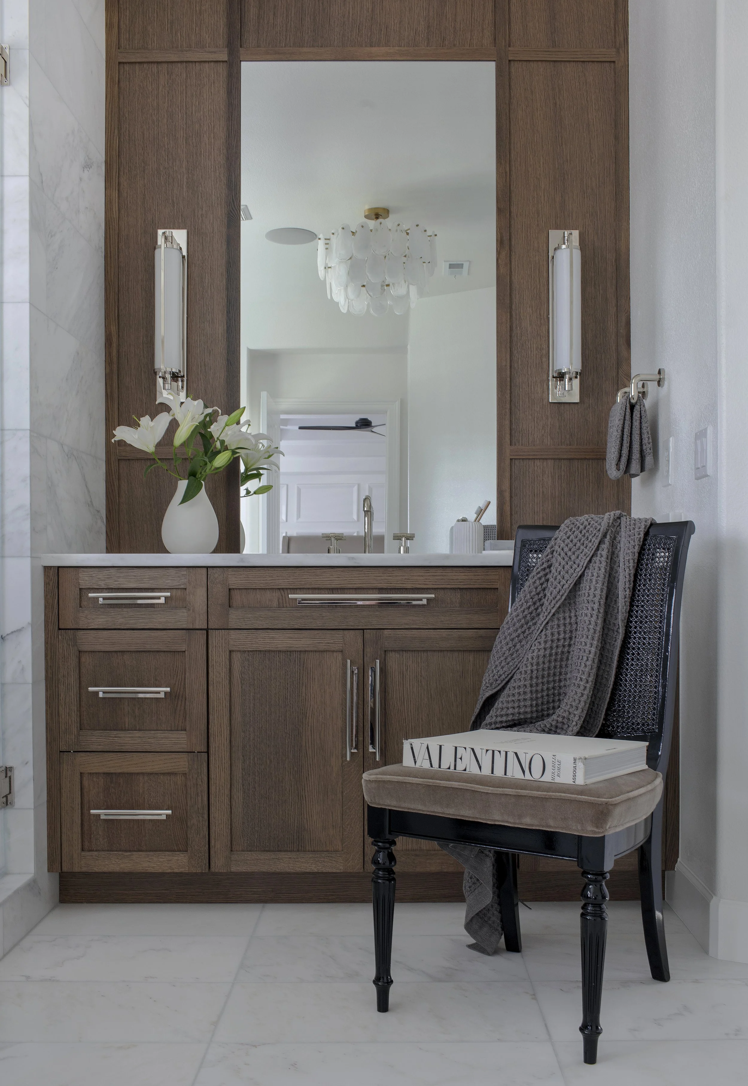 no 005 master bathroom vanity wood cabinetry silver hardware antique mohair chair