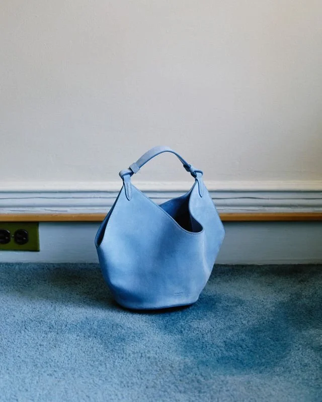 Embark blue a pillar of stability in interior design blue handbag