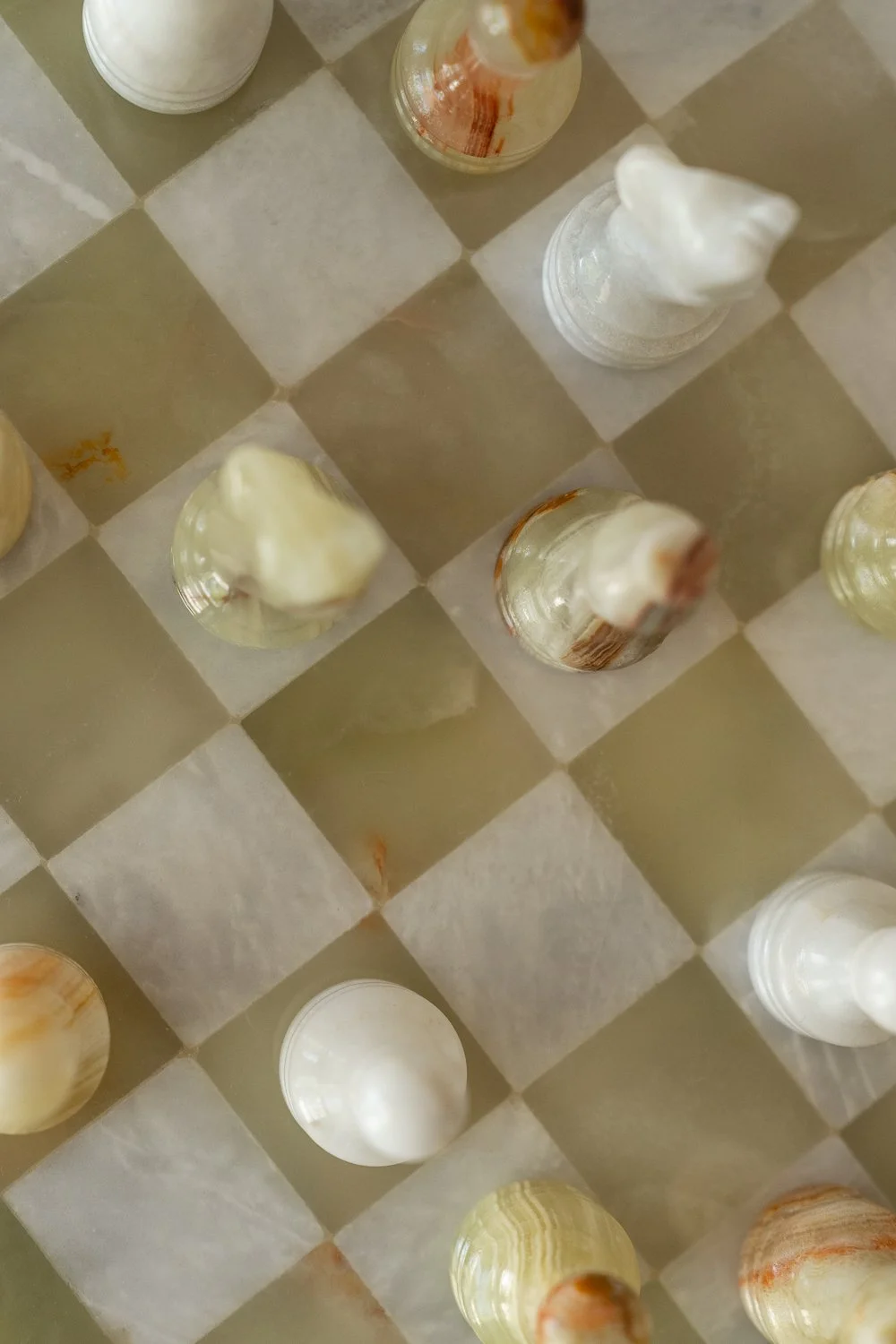 Embark building a team the foundation of Studio Thomas green and white marble chess board