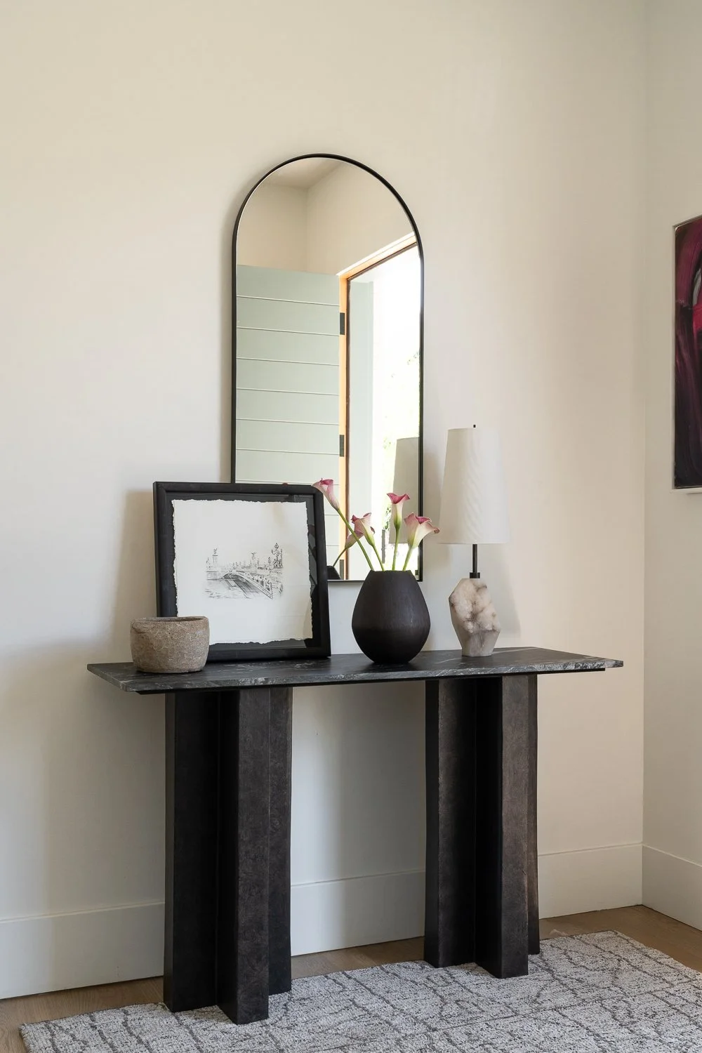 Studio Thomas Denver bespoke interior design no 035 entry dark marble console table custom artwork arched mirror