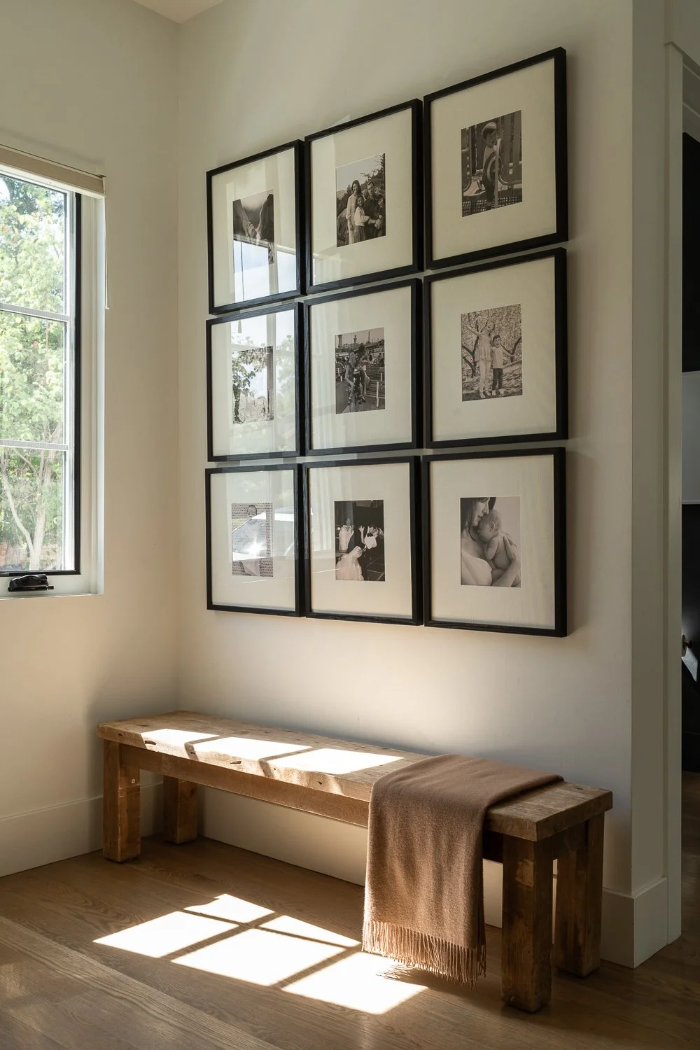 Studio Thomas Denver bespoke interior design no 035 entry wood bench gallery wall light brown blanket