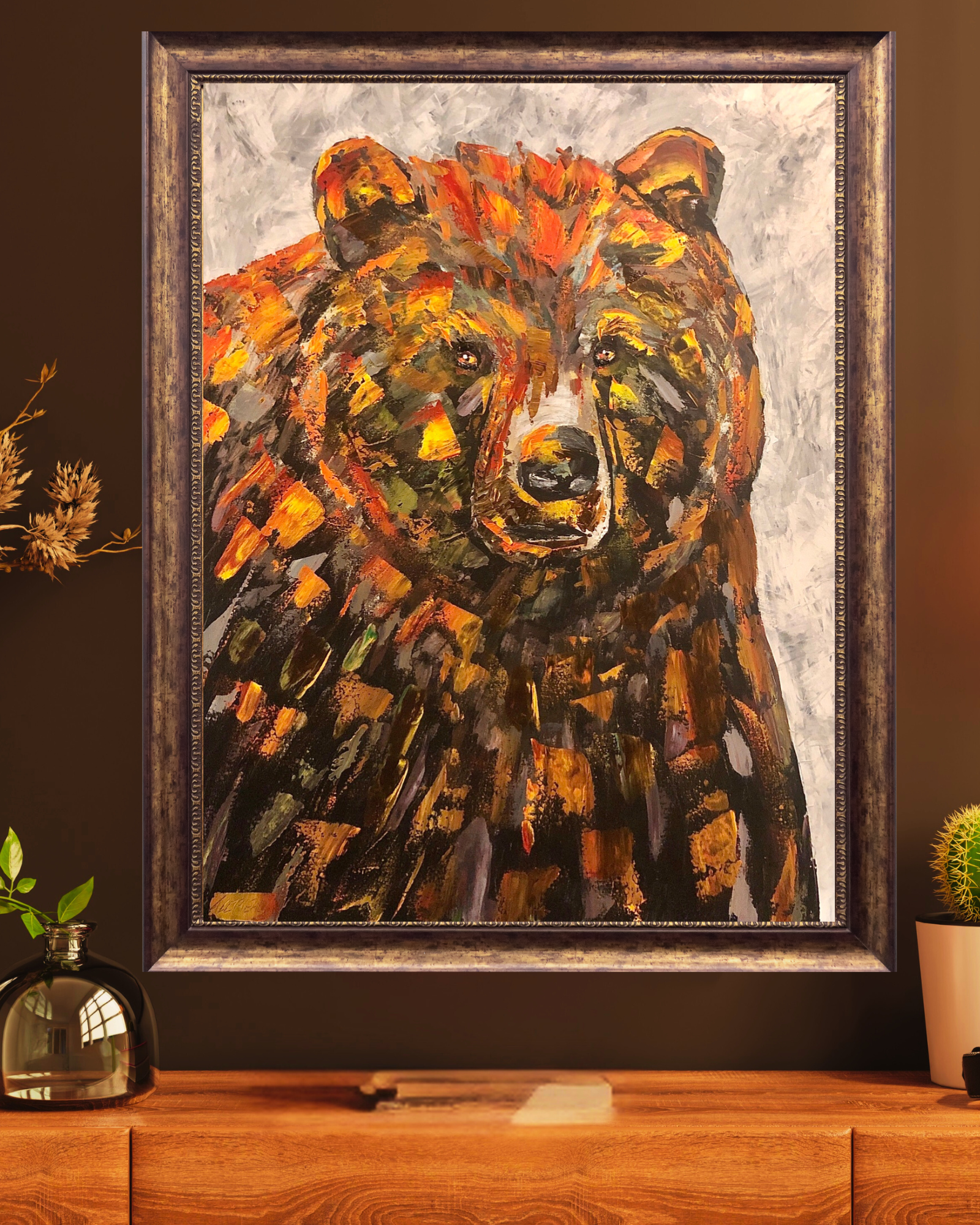 Bear painting by Alex Lorieau in frame on wall
