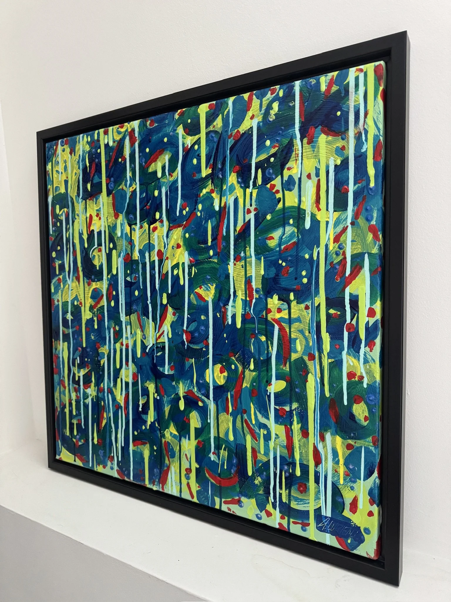 Blue and yellow evo graffiti painting with red drips