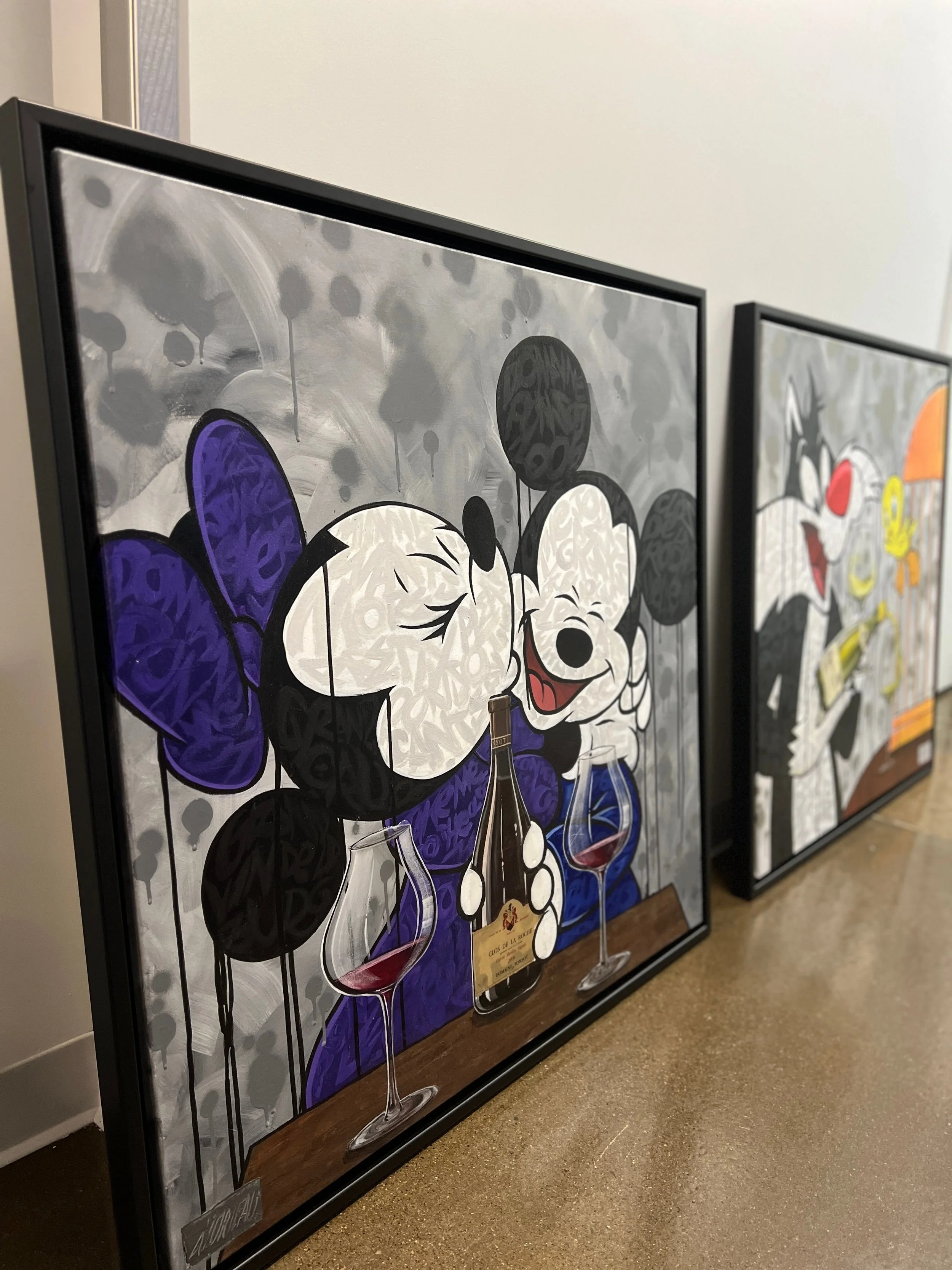 two framed Alex Lorieau wine series paintings