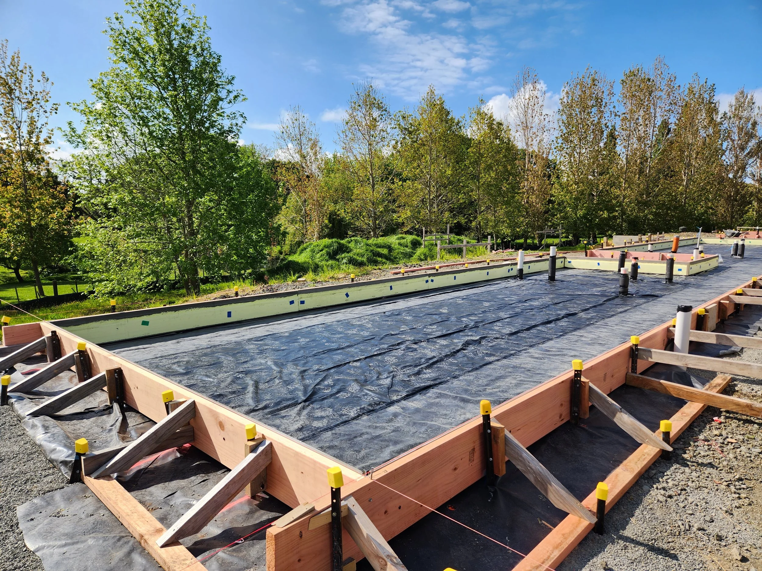 polythene and boxing being installed for a rib raft concrete slab in kaukapakapa