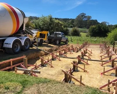 Timber house pile foundations braced for a concrete pour on an Oxen work site in Auckland