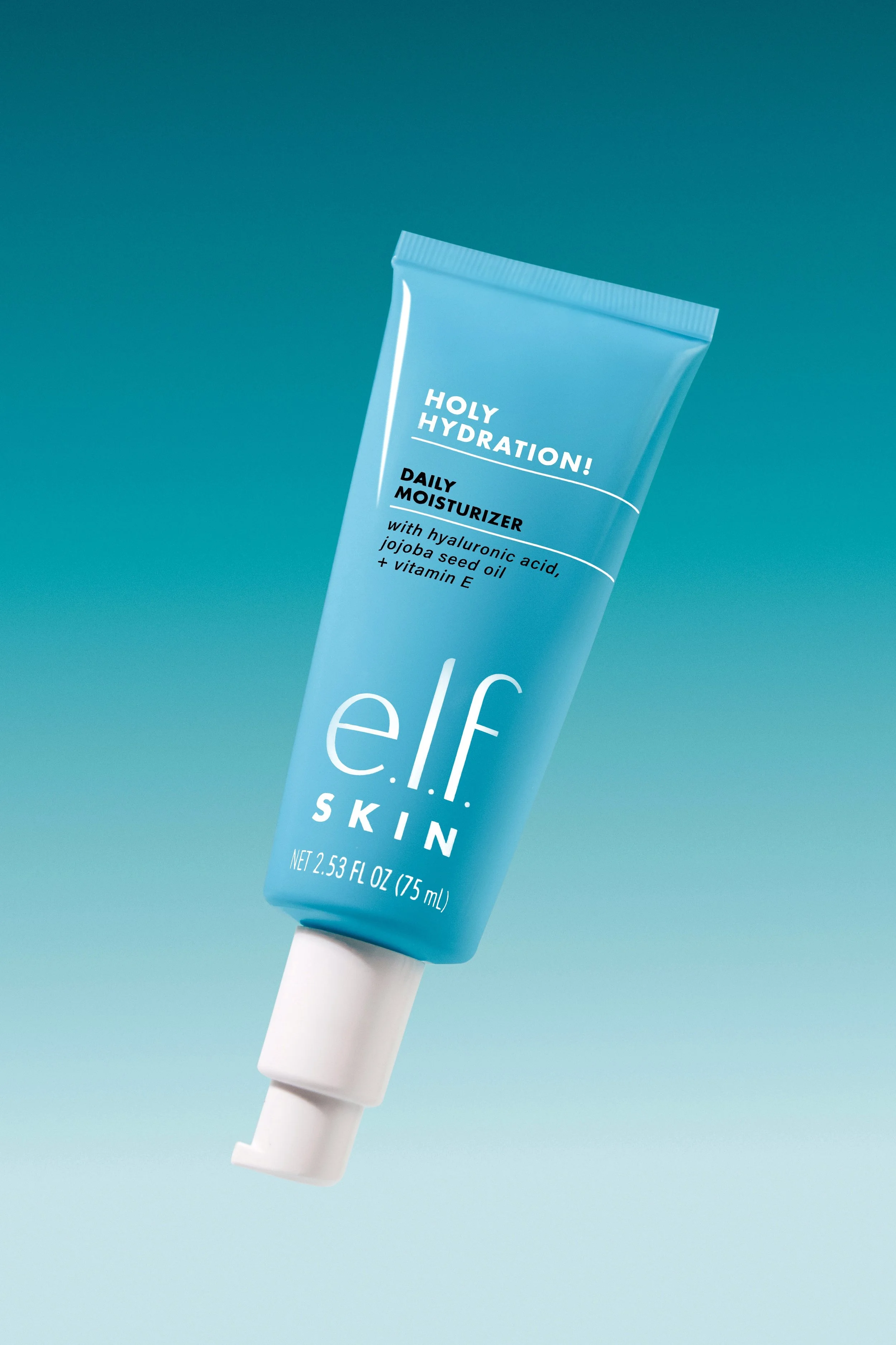 A tube of e.l.f. Skin Holy Hydration Daily Moisturizer. Commercial product photography for CPG beauty and skincare brands, creating e-commerce, social media, and marketing-ready product images.