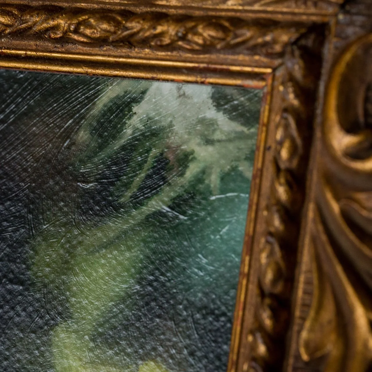 detail of hand brushed canvas in gold frame