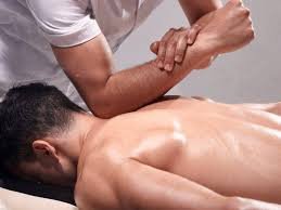 Person receiving a back massage from a massage therapist.