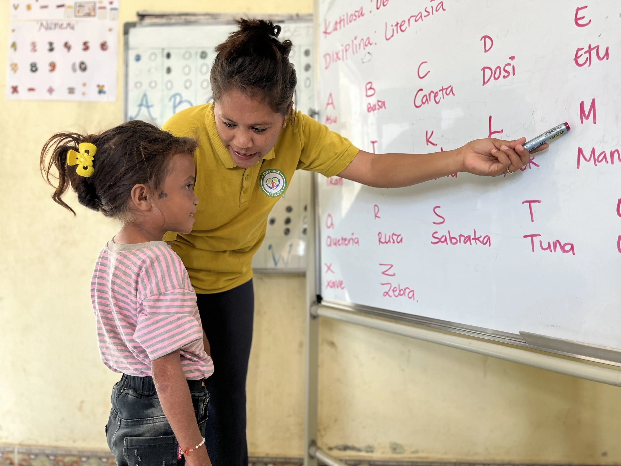 Students learning the alphabet during class time