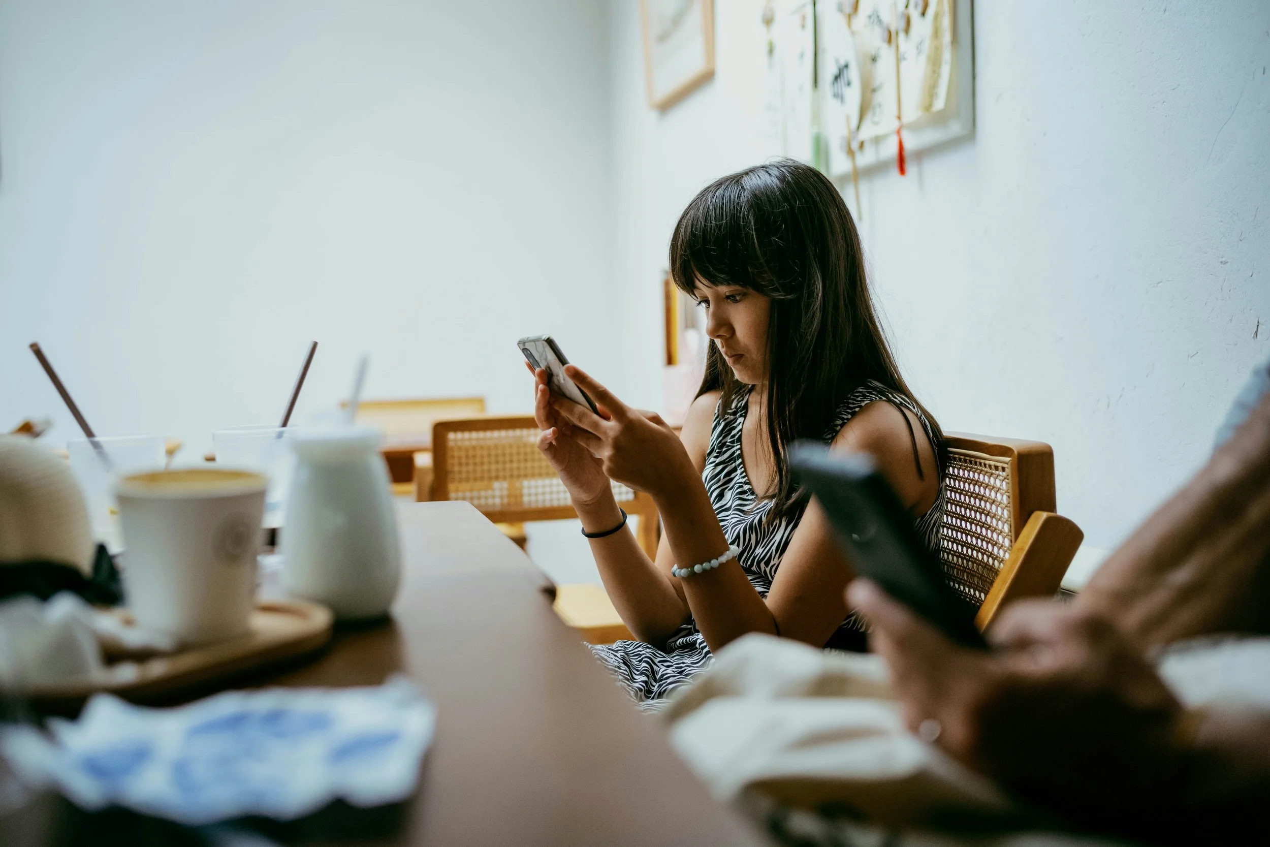 Thoughtful young adult looking at their reflection while considering beauty standards, social media comparison, self-esteem, body image, and mental health